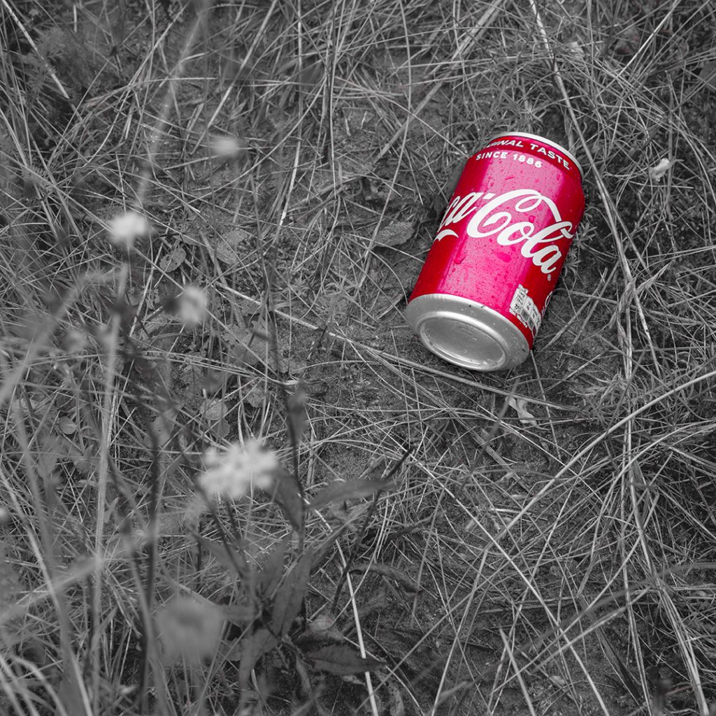 Coke can in the grass