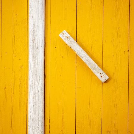 Door handle on ochre door